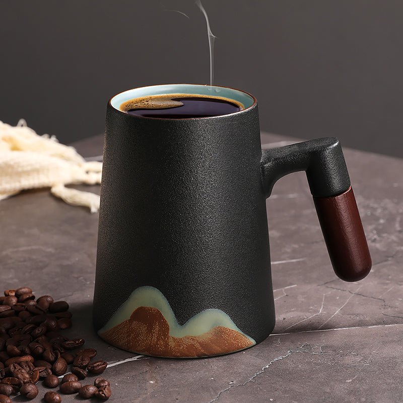 Peppermint tea mug for small coffee setup beside a compact coffee maker and tea tin on a narrow counter