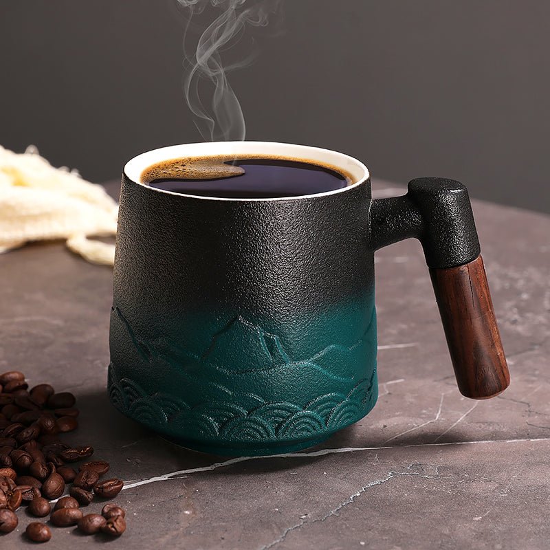 Clay pottery coffee mugs for small coffee setup arranged beside a compact coffee maker on a narrow kitchen counter