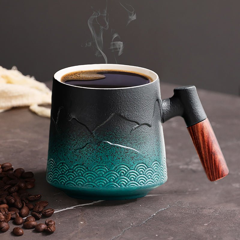Ceramic coffee mugs with large handles for small coffee setup arranged on a compact kitchen coffee station