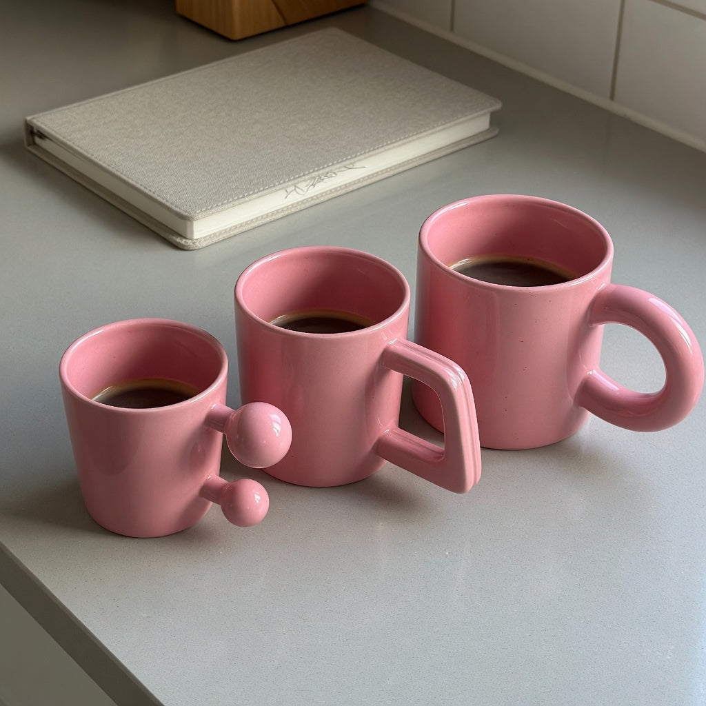 Three pink ceramic mugs with different handle shapes for a pink ceramic coffee mug gift choice practical purchase checklist