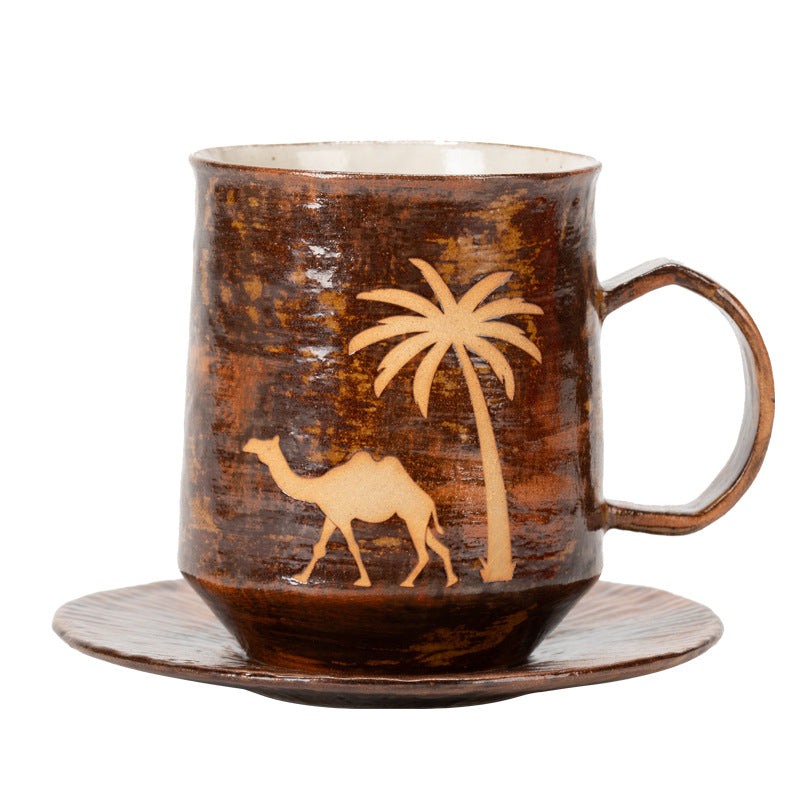 Brown ceramic coffee mug and saucer with camel and palm tree decoration