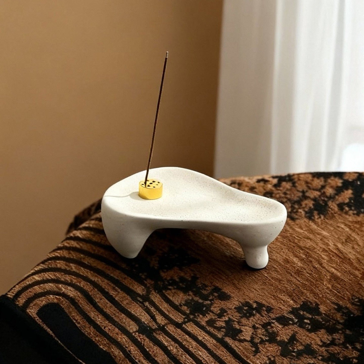 White footed ceramic tray styled with an incense holder