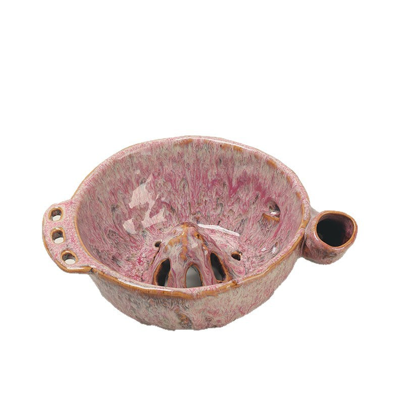 Rose pink ceramic berry washing bowl with a central perforated cone