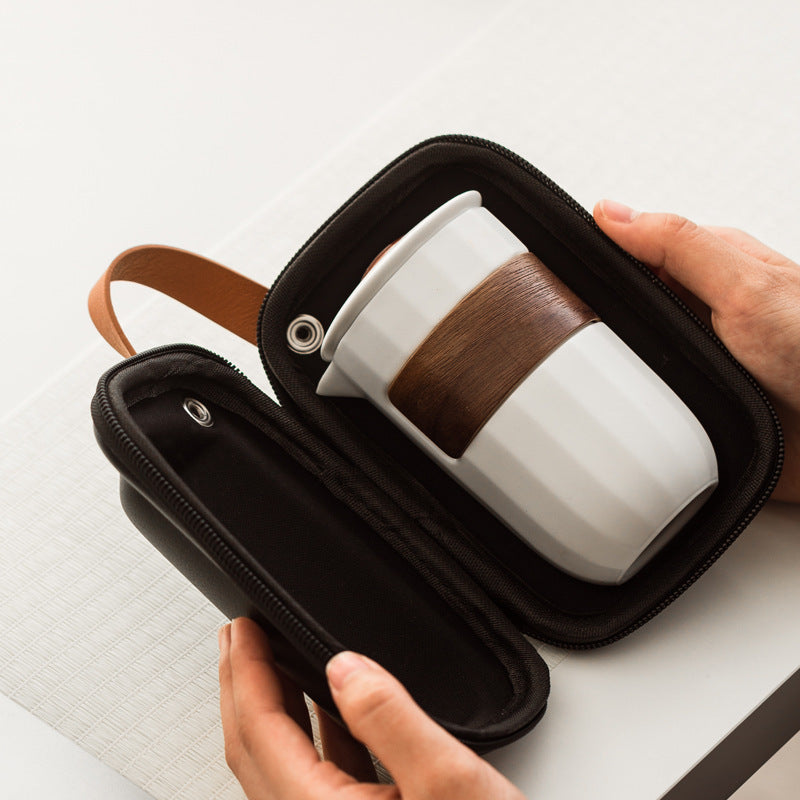 Compact ceramic travel tea set packed into its zipped carry case