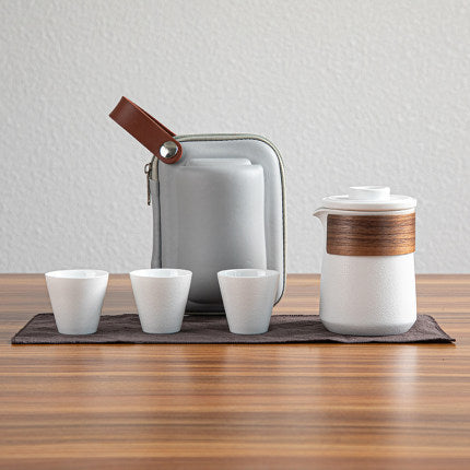 White Ceramic travel tea set with three cups and a carry case