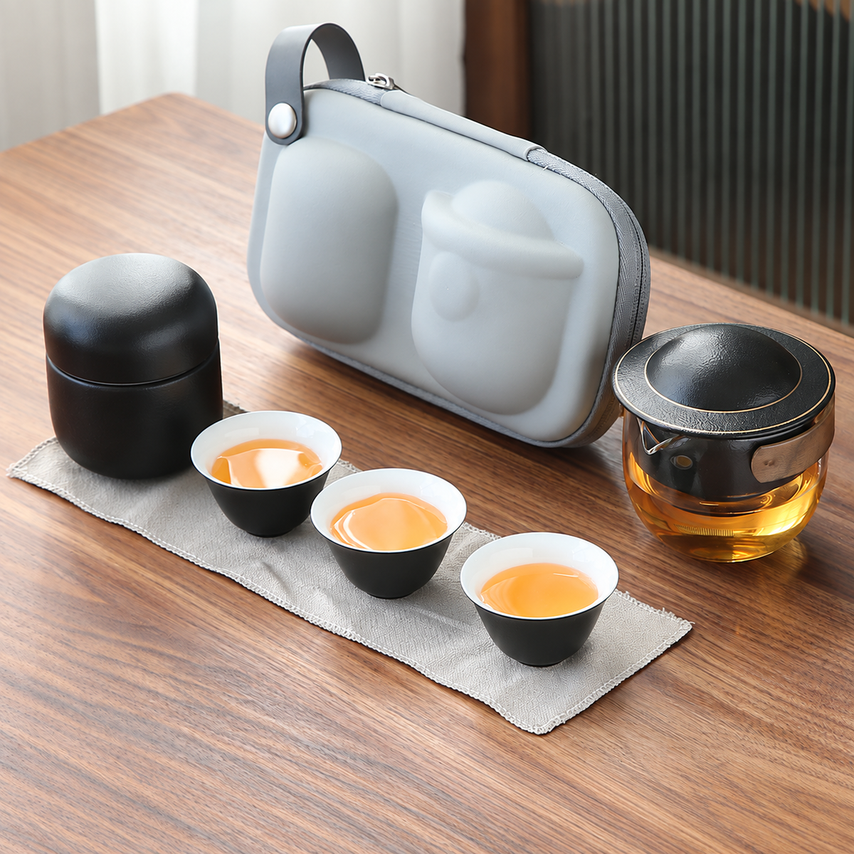 Black with Tea Canister glass travel tea set with pivoting ceramic infuser, three cups and gray carrying case