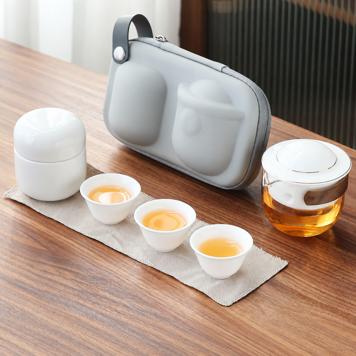 White with Tea Canister glass travel tea set with pivoting ceramic infuser, three cups and gray carrying case