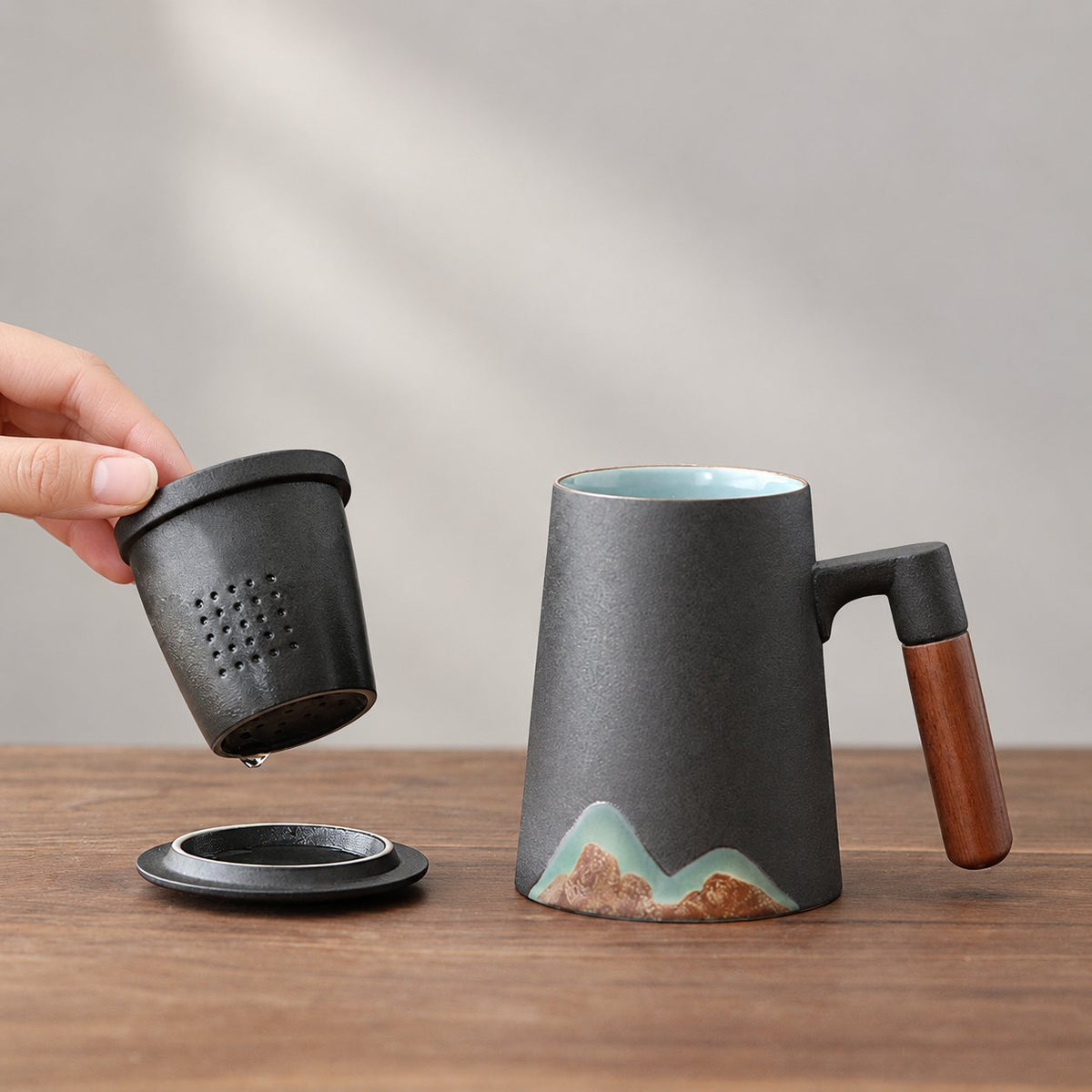 Black mountain motif mug with removable ceramic infuser