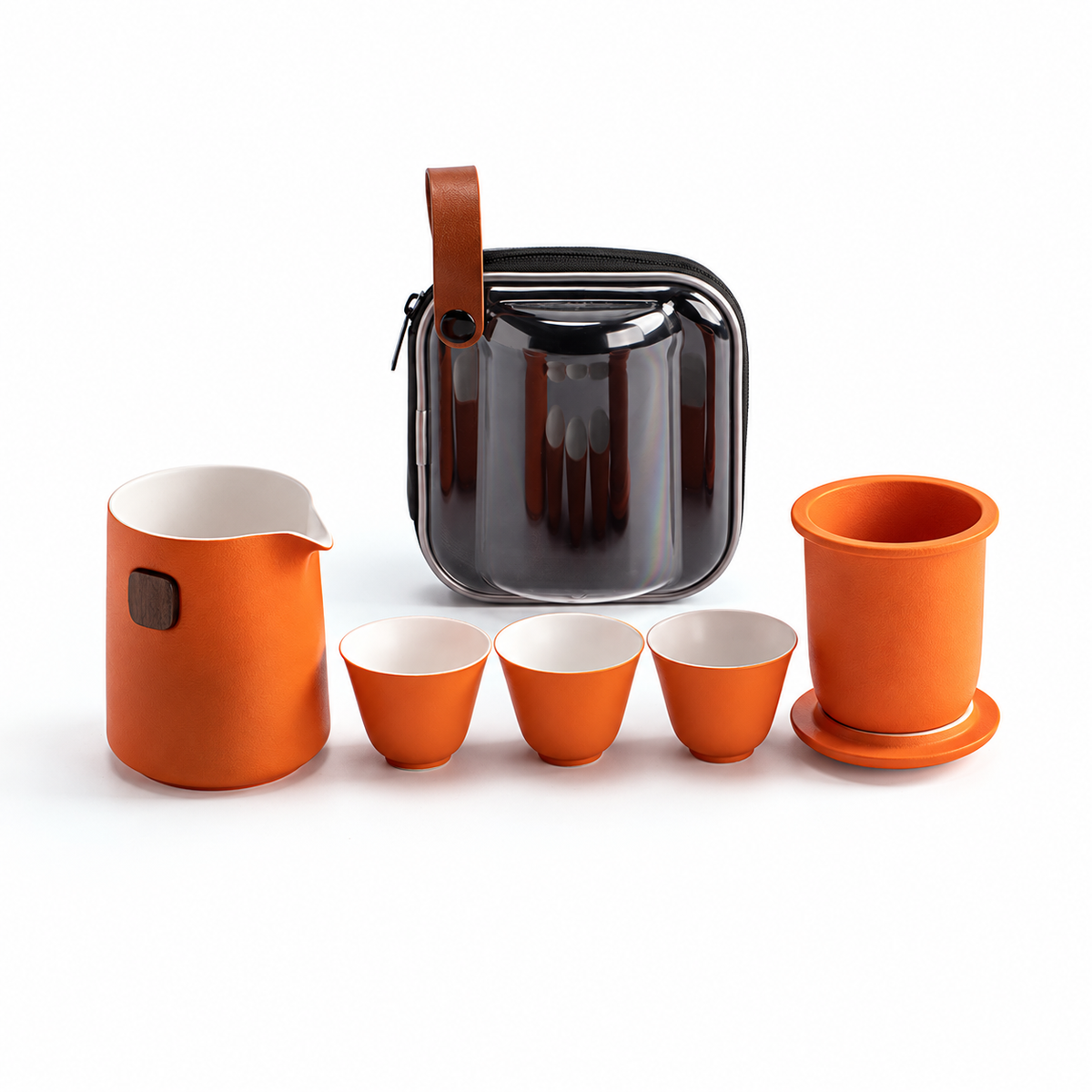 Orange ceramic travel tea set with server, infuser, lid, three cups and clear case