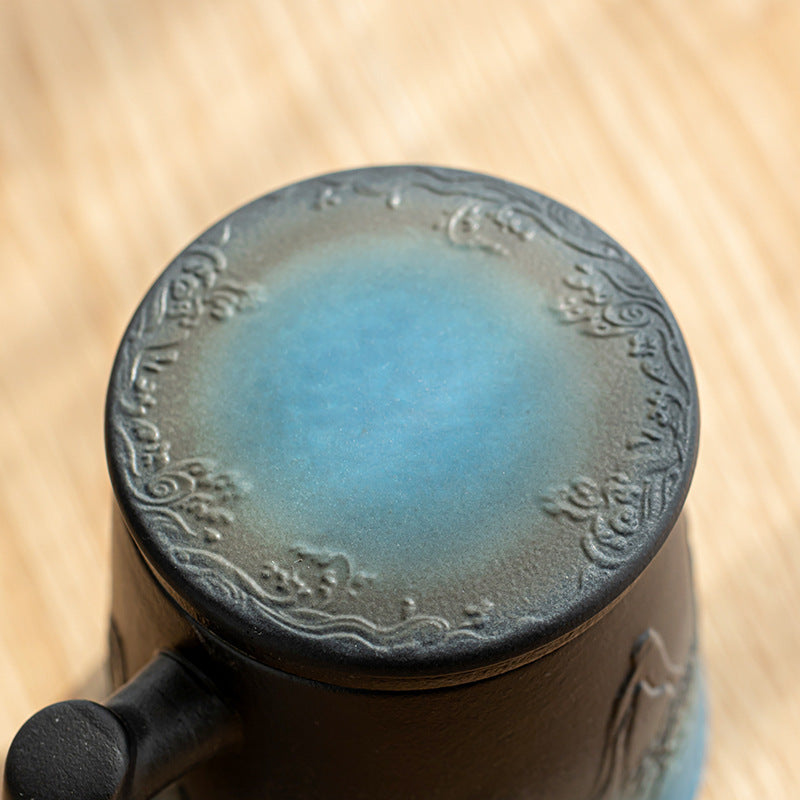 Blue ceramic mug lid with raised wave decoration