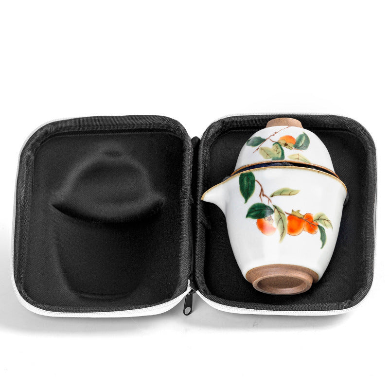 Blue travel case open to show the nested ceramic tea set