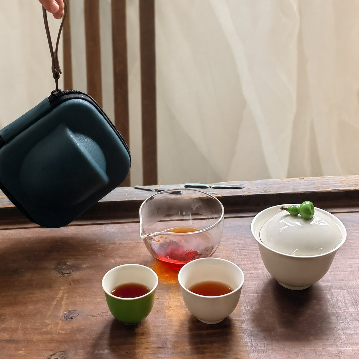 Ceramic gourd lid travel tea set with two cups and a glass pitcher