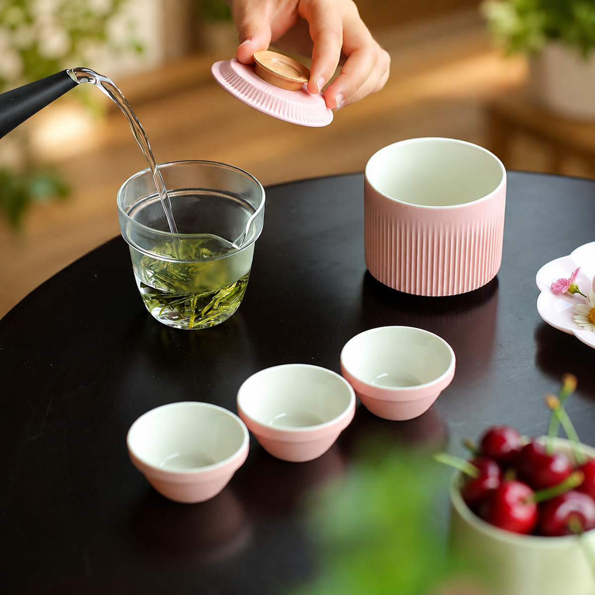 Pink ribbed ceramic travel tea set with three cups