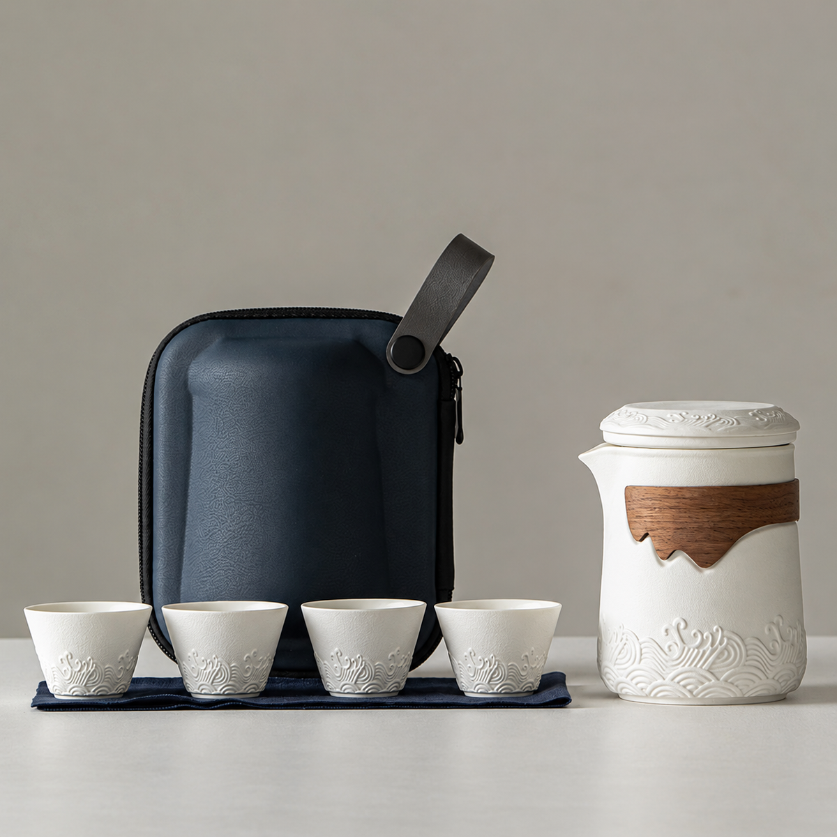 White travel tea set with its included pieces and actual carrying packaging
