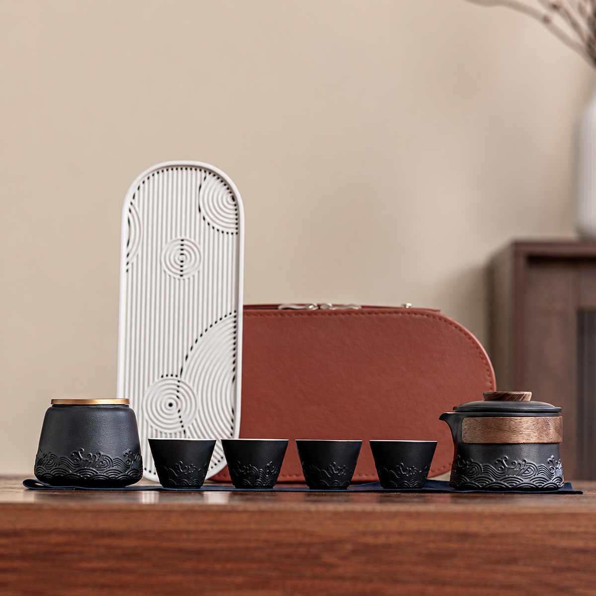 Black wave relief travel tea set with four cups and tea canister