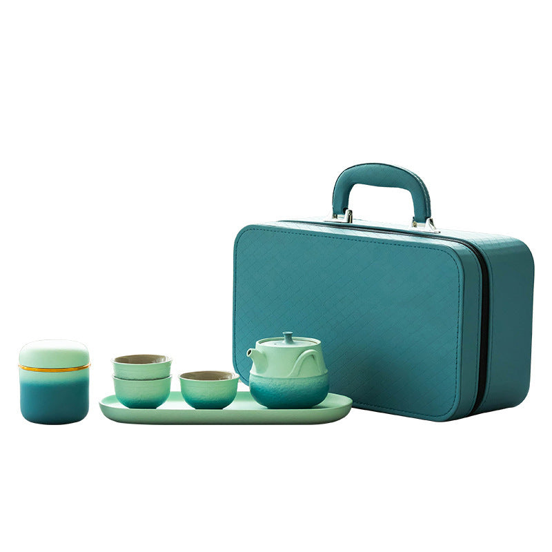 Teal gradient tea set with lidded pot, cups, tea jar, tray and carrying case