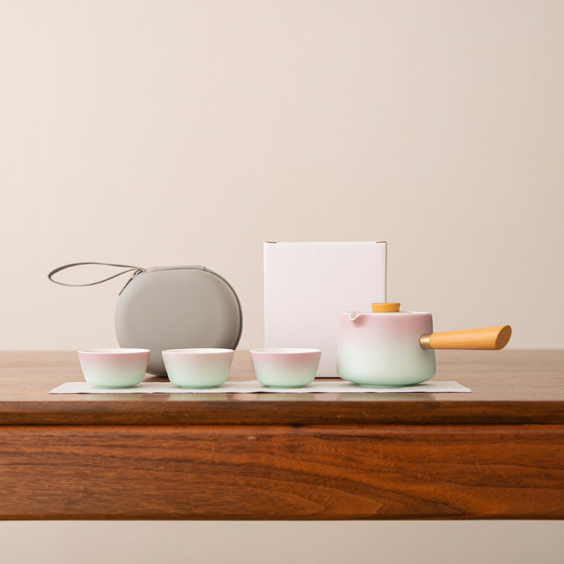Pink and mint side-handle ceramic tea set with three cups, cloth, round case and plain carton