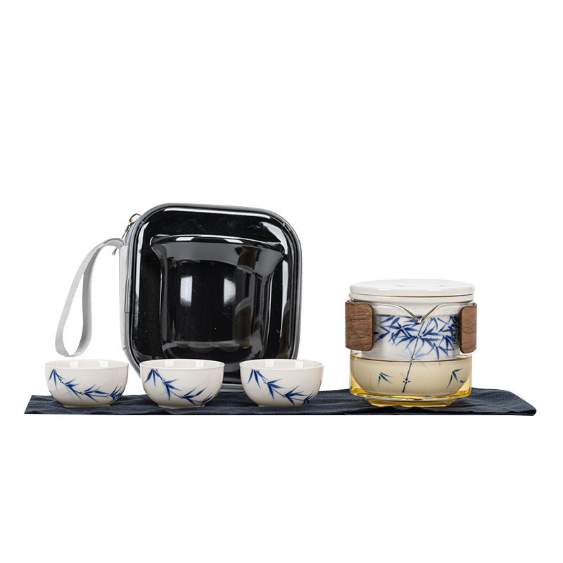 Blue bamboo-painted glass and ceramic travel tea set with three cups, cloth and translucent case