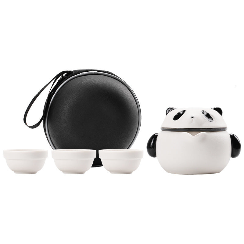 Front view of panda lid, side grips, three cups and round black carrying case