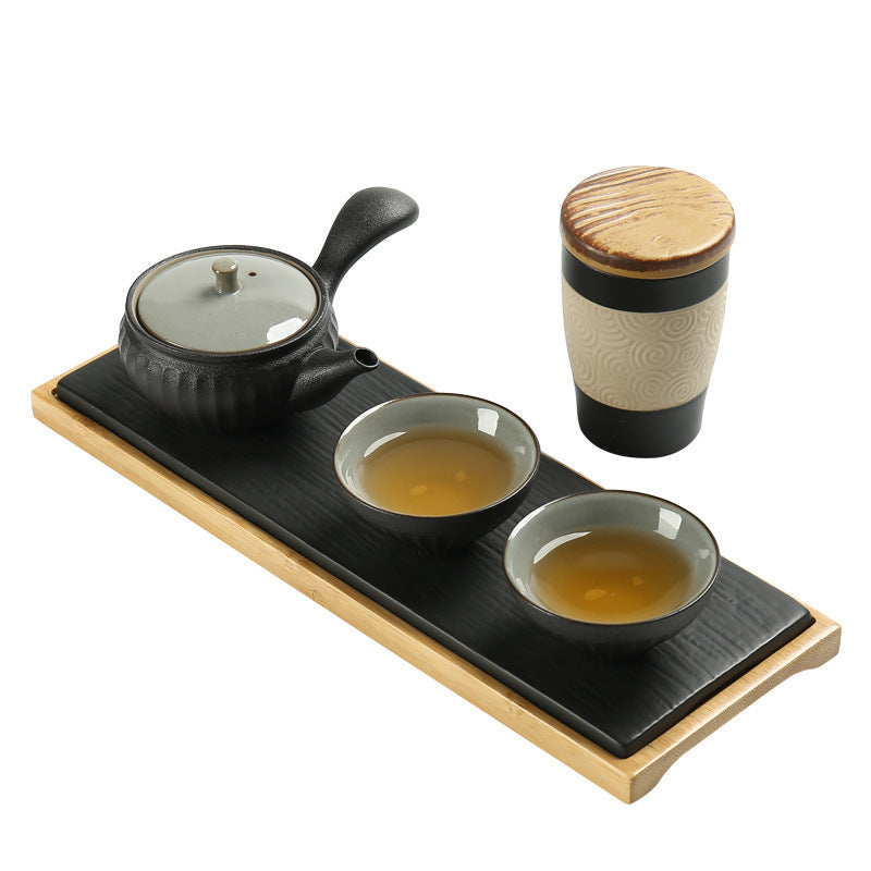 Charcoal ceramic tea set with side-handle teapot, two cups, tea canister and tray