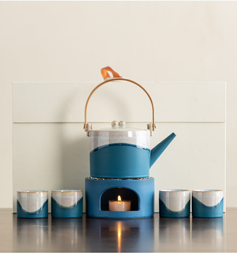Blue arched-handle ceramic teapot, matching warmer and four cups with ivory gift box