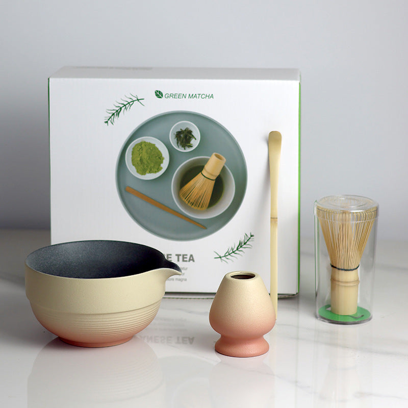 Yellow and Orange - 4 Pieces matcha set showing the bowl, holder, whisk, scoop and actual retail box