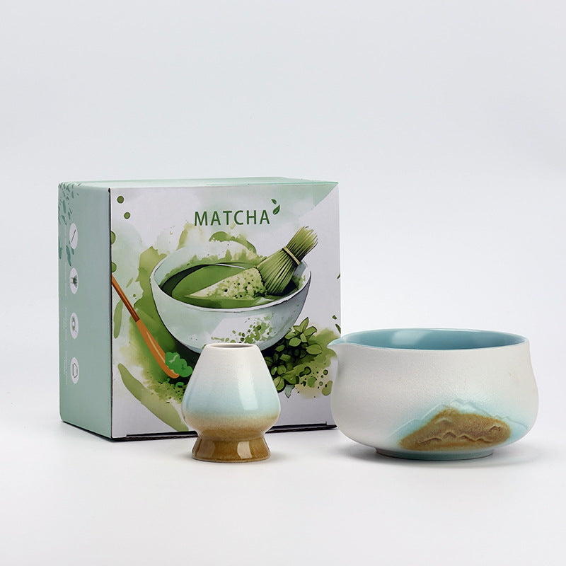 White mountain-pattern ceramic matcha bowl and whisk holder with the included MATCHA box