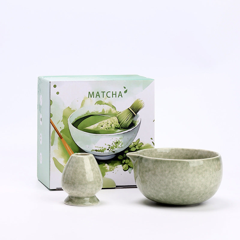 Round Bowl - Matcha Green ceramic bowl and coordinating whisk holder beside the associated MATCHA carton