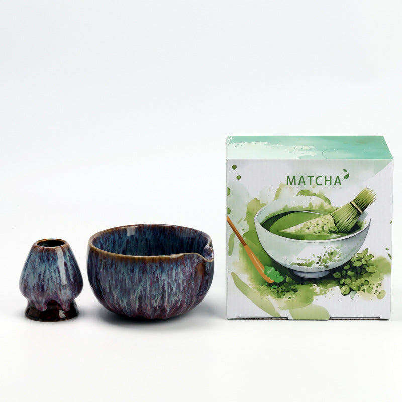 Flowing Glaze - Blue Purple ceramic bowl and coordinating whisk holder beside the associated MATCHA carton