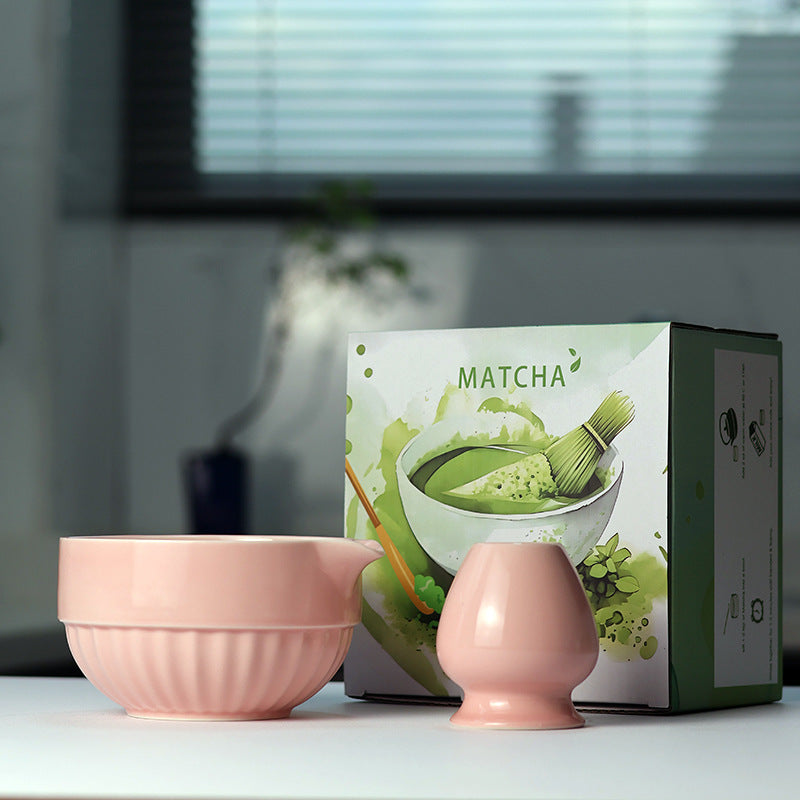 Fluted Bowl - Soft Pink ceramic bowl and coordinating whisk holder beside the associated MATCHA carton