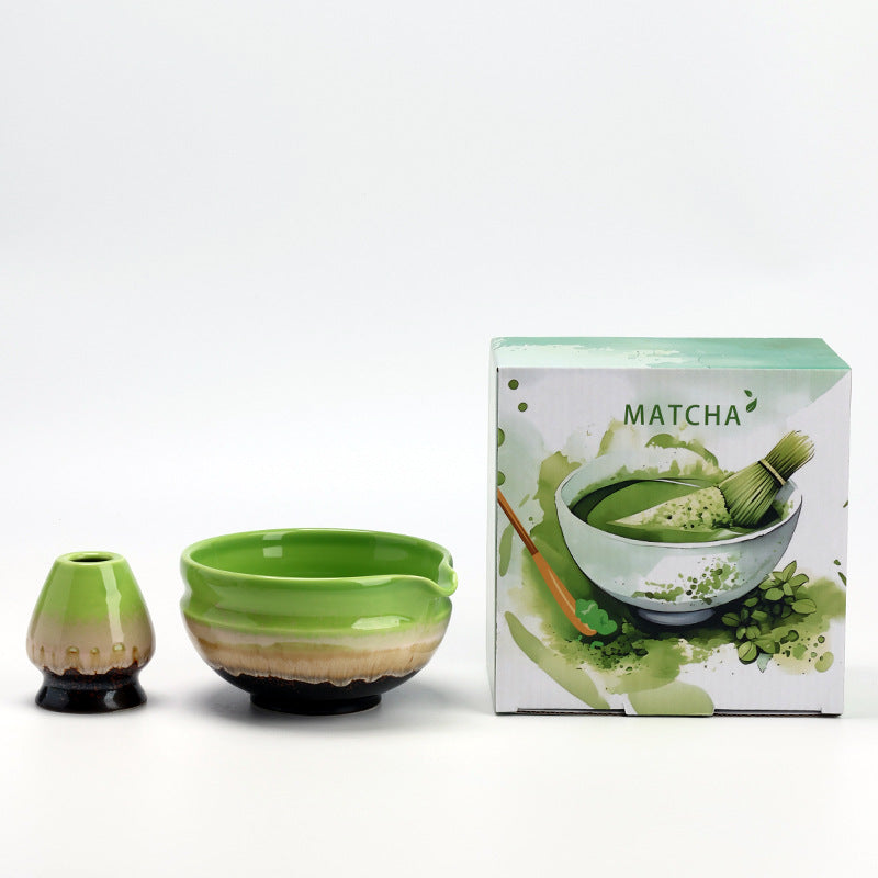 Wide Rings - Spring Green ceramic bowl and coordinating whisk holder beside the associated MATCHA carton