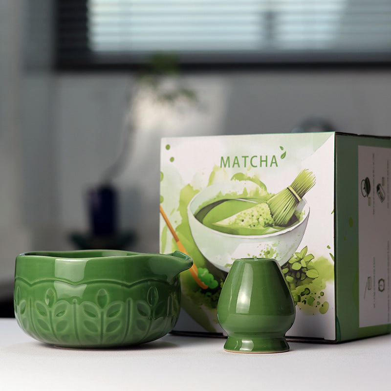 Leaf Relief - Emerald Green ceramic bowl and coordinating whisk holder beside the associated MATCHA carton