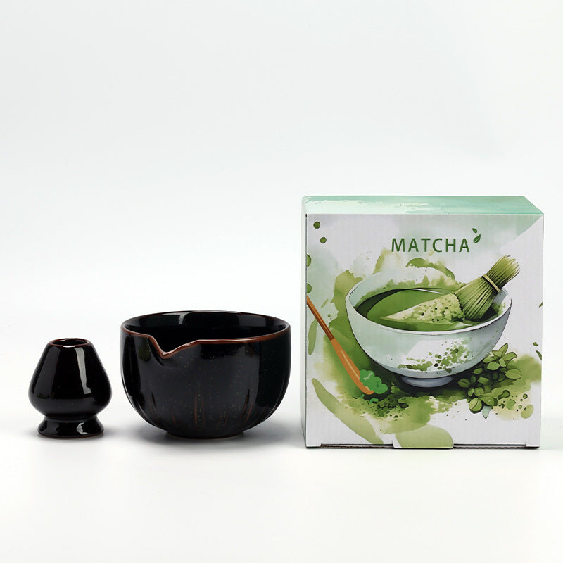 Petal Bowl - Glossy Black ceramic bowl and coordinating whisk holder beside the associated MATCHA carton
