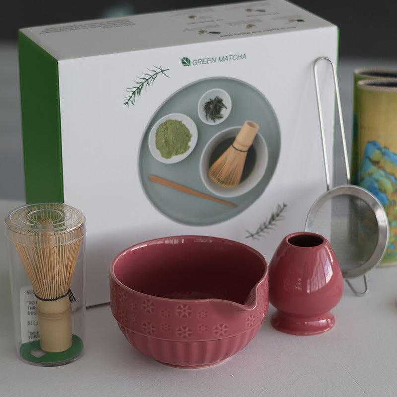 Rose Pink bowl and holder beside the actual clear whisk tube and English presentation carton