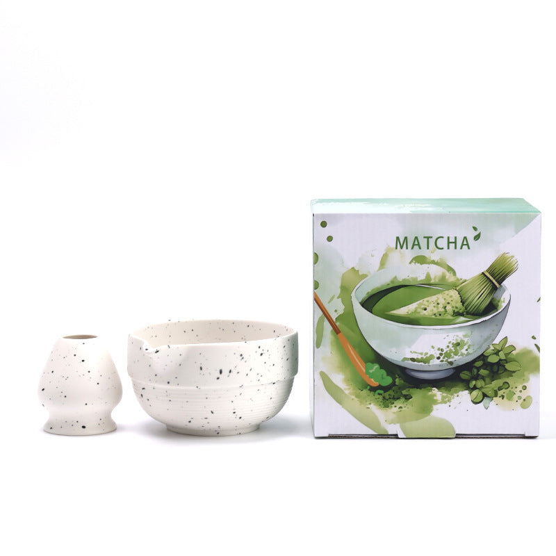 Speckled white fine-ridged matcha bowl and ceramic whisk holder with their English MATCHA box