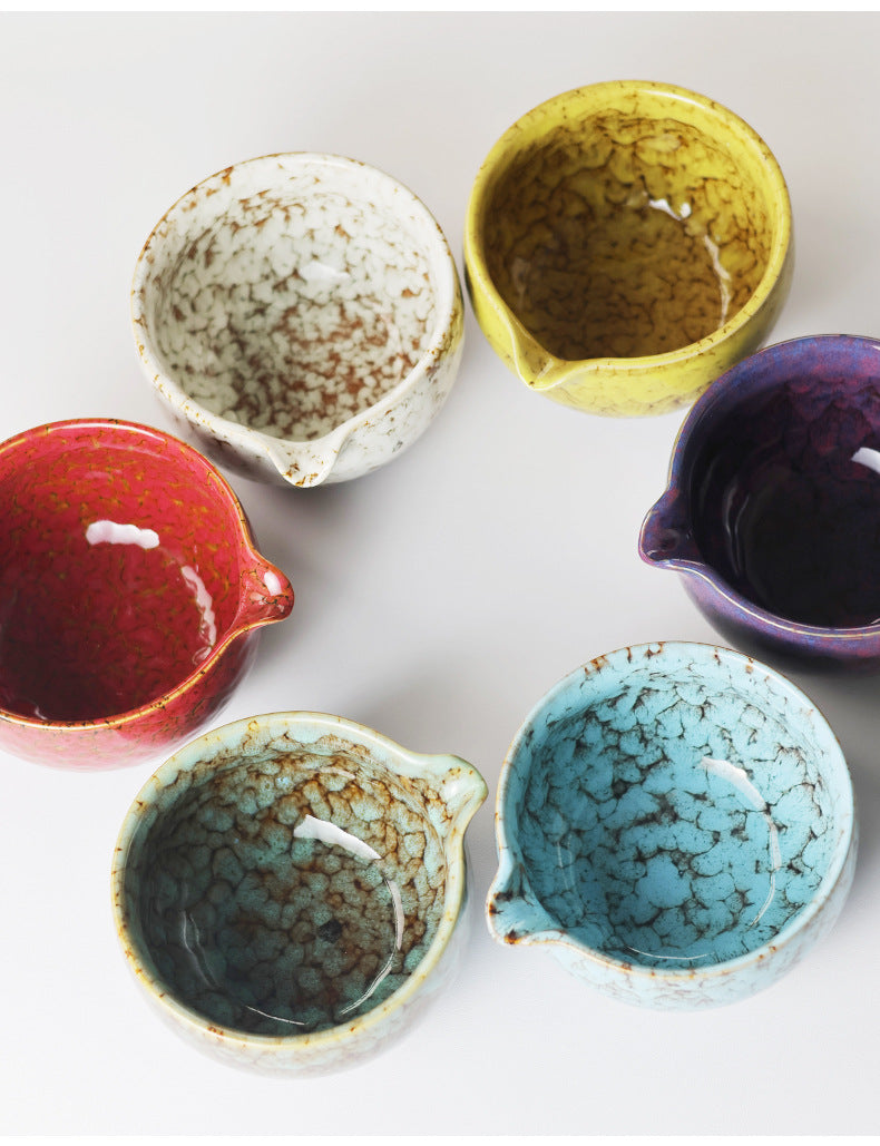 Overhead comparison of all six matcha bowl colors showing their glazed interiors and pouring spouts