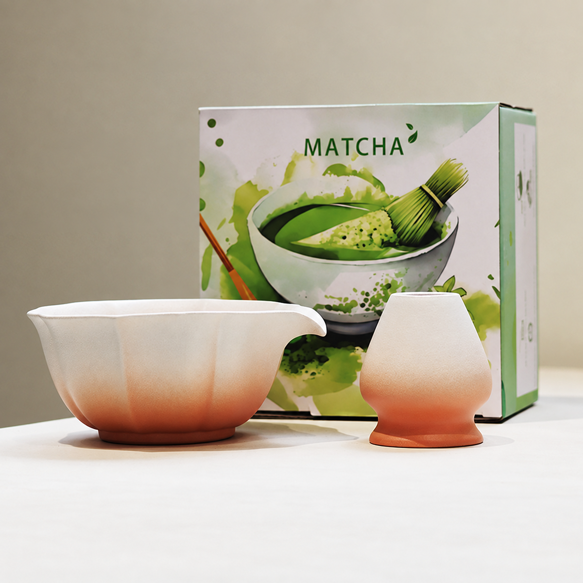 Pink scalloped ceramic matcha bowl and whisk holder with printed English gift box