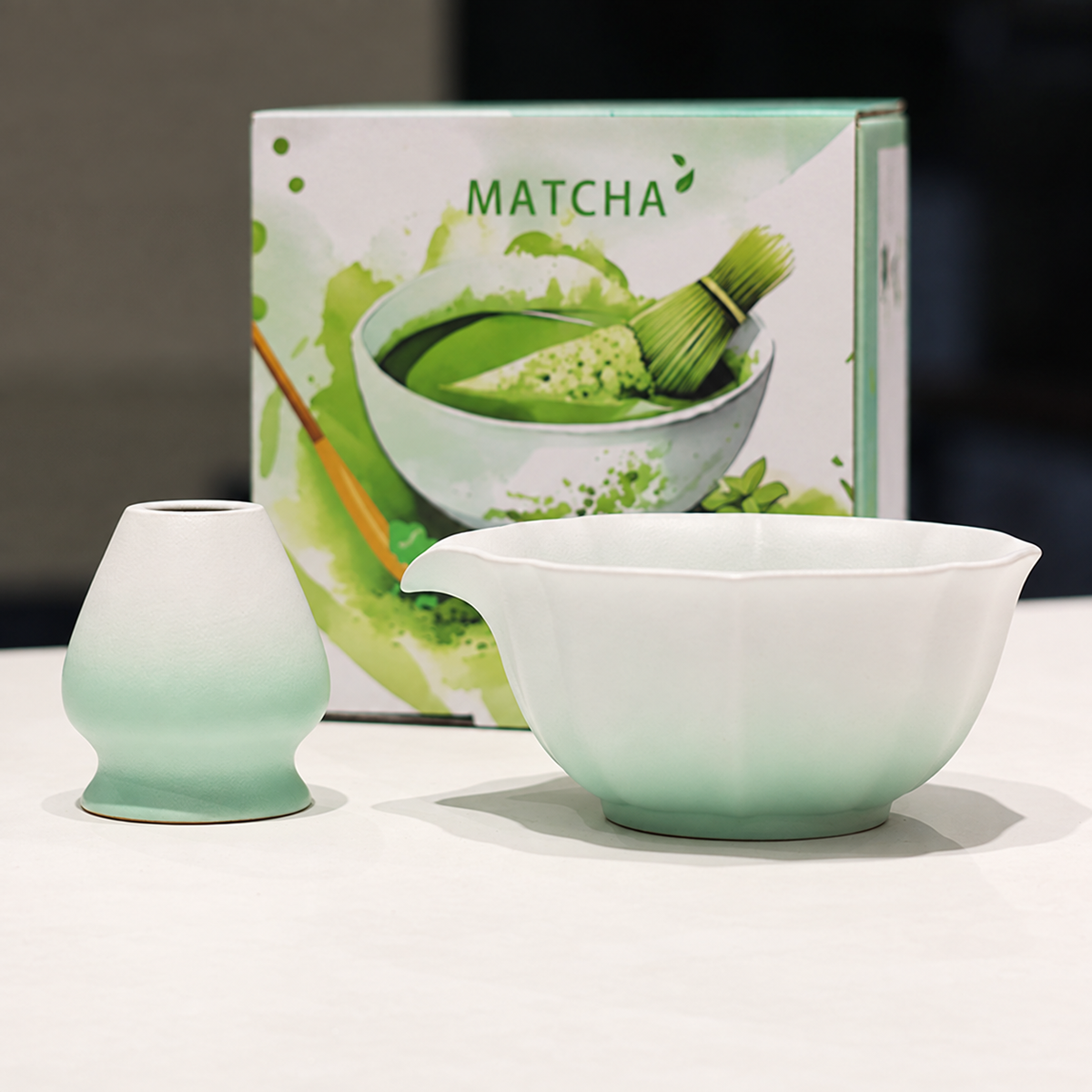 Green scalloped ceramic matcha bowl and whisk holder with printed English gift box