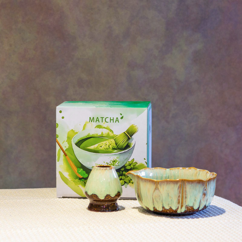 Celadon green lotus-rim matcha bowl and ceramic whisk holder with the included MATCHA box