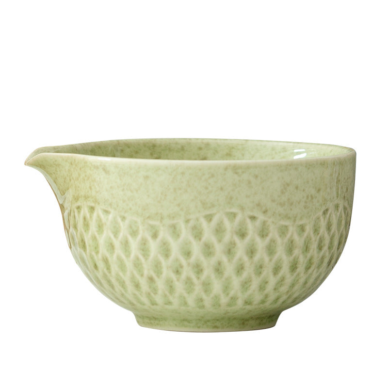 Close view of the diamond relief pattern and pouring spout on the matcha green bowl