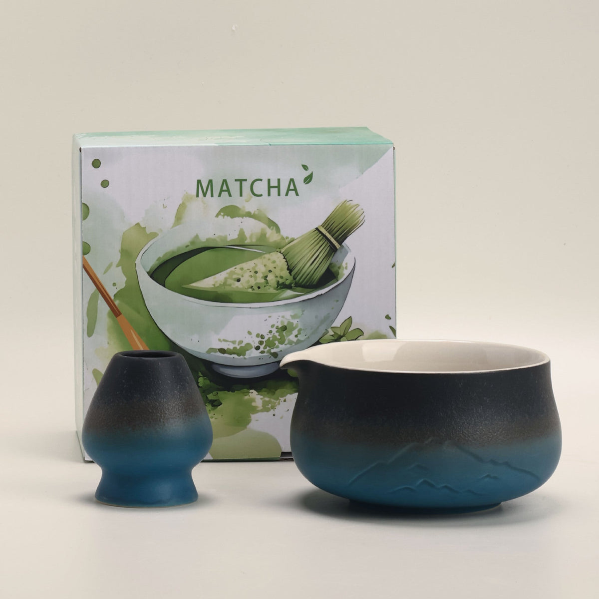 Black and blue mountain-relief matcha bowl and ceramic whisk holder with the included MATCHA box