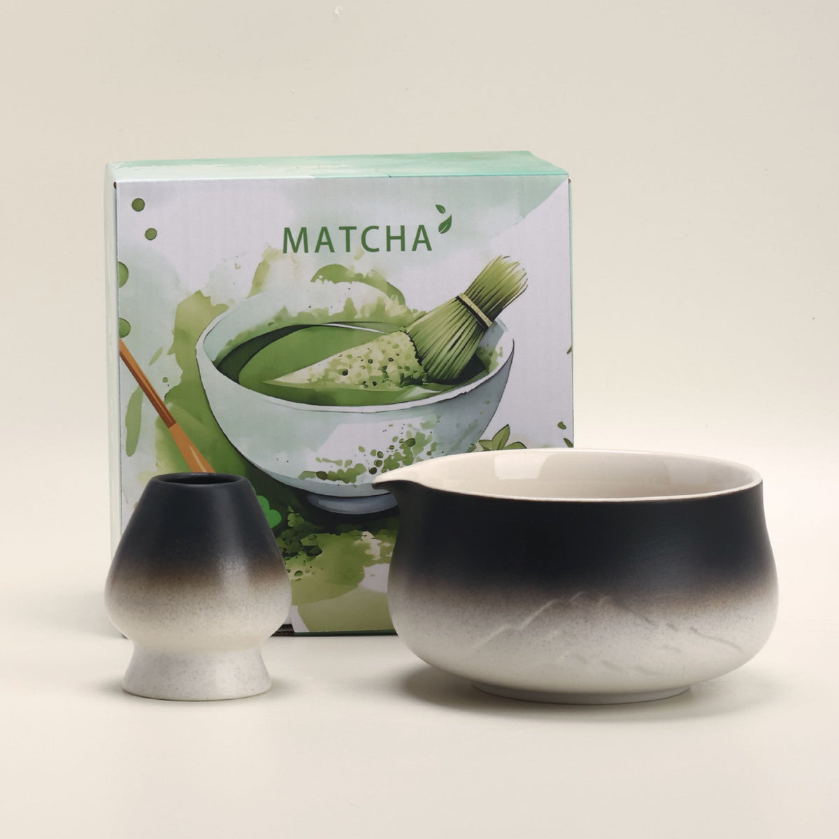 Black and white mountain-relief matcha bowl and ceramic whisk holder with the included MATCHA box