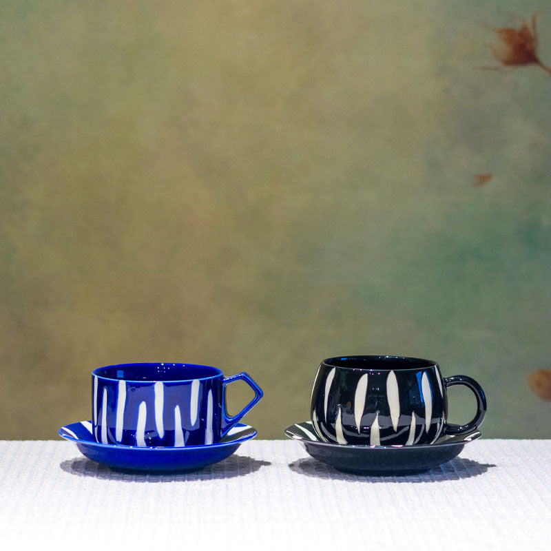 Cobalt blue and black striped ceramic cup and saucer styles