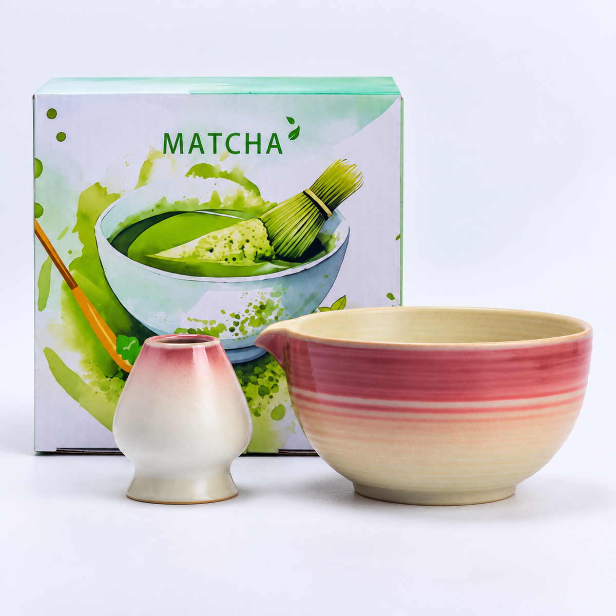 Burgundy gradient ribbed matcha bowl and coordinating ceramic whisk holder with the included MATCHA presentation carton.